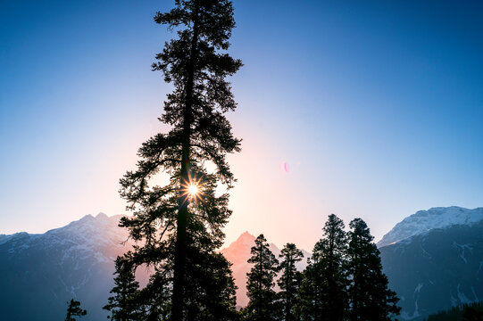Sunrise in the mountains. These are the scenic meadows of the Parvati valley Himalayan region. Peaks and alpine landscape from the trail of Sar Pass trek, Himalaya, Kasol, Himachal Pradesh, India.