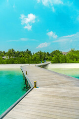 Exotic wooden villa on the water at Club Med Finolhu, a resort located on a very quiet and comfortable small island in the Maldives with stunning sea views	