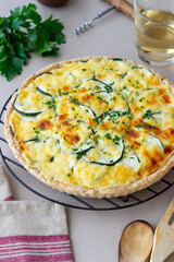 Pie with zucchini, cheese and herbs. Quiche. Vegetarian food. Healthy eating.
