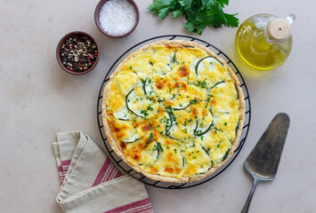 Pie with zucchini, cheese and herbs. Quiche. Vegetarian food. Healthy eating.