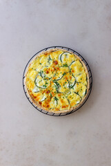 Pie with zucchini, cheese and herbs. Quiche. Vegetarian food. Healthy eating.