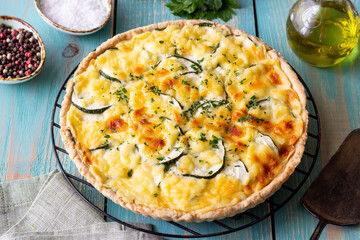 Pie with zucchini, cheese and herbs. Quiche. Vegetarian food. Healthy eating.