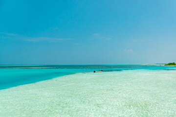 The beauty of the beaches and seas of the Maldives islands that attract tourists from all over the world, tropical islands with white sand and clear sea water in the Maldives