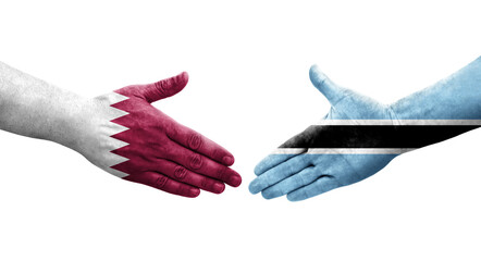 Handshake between Botswana and Qatar flags painted on hands, isolated transparent image.