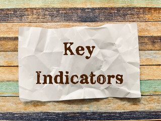 key indicators word on crumpled paper note