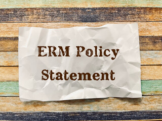 ERM policy statement word on crumpled paper note