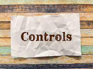 controls word on crumpled paper note