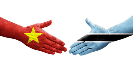 Handshake between Botswana and Vietnam flags painted on hands, isolated transparent image.