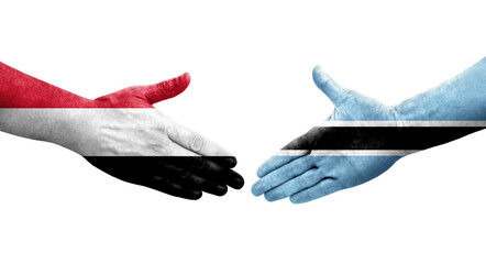 Handshake between Botswana and Yemen flags painted on hands, isolated transparent image.