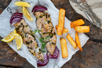 Fish and chips with grilled mackerel kebabs