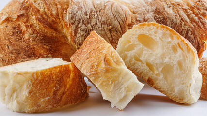 Sliced baguette on a white background. Fresh baguette.