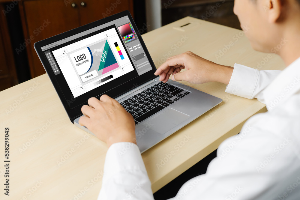 Poster graphic designer software for modern design of web page and commercial ads showing on the computer s
