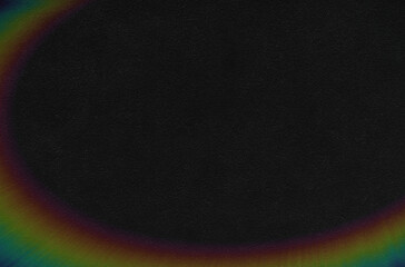 Dark background with a rainbow. Part of the rainbow on a dark abstract background