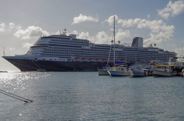Huge modern HAL cruiseship or cruise ship liner Koningsdam in port during Caribbean cruising dream...