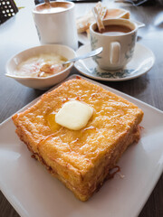 french toast with honey syrup and butter served during breakfast