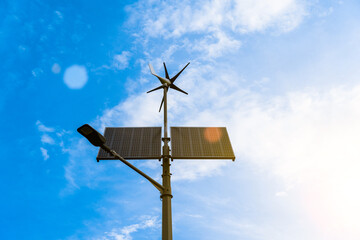 Wind turbines solar panels. Renewable photovoltaic technology with solar energy power panel and wind turbine. Solar energy panels power.