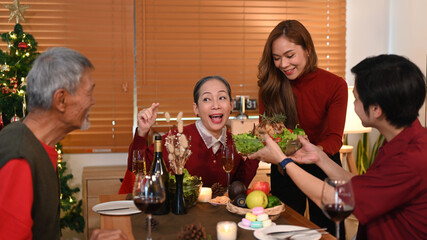 Joyful family having Christmas dinner in comfortable home. Christmas and thanksgiving concept