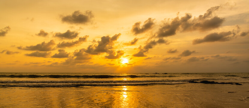 Dramatic sunset sky over the sea at Phuket Thailand. Cloudy sunset and sunrise sky at sea concept panorama image.
