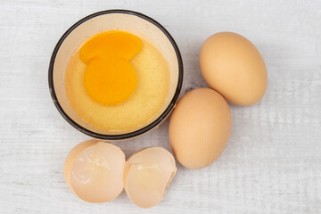 Eggs isolated on white background, broken chicken eggs with yolk. Close up view