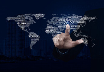 Businessman pressing 2023 start up icon with global business words world map over city tower and skyscraper, Happy new year 2023 global business start up, Elements of this image furnished by NASA