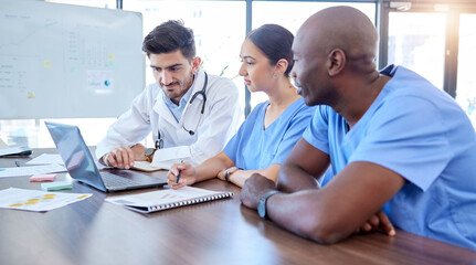 Laptop, meeting and healthcare with a doctor team doing research in hospital boardroom for health...
