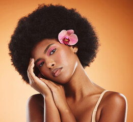 Black woman, beauty and makeup, skin and face with flower, hair and natural cosmetics advertising. African American model, skincare and cosmetology treatment, glow in portrait with studio background.