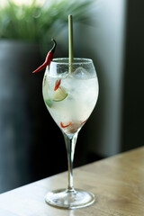 modern thai cocktail with rice wine, chilli pepper, lime and lemongrass