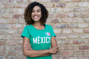 Naklejka na ściany i meble Laughing mexican female football fan