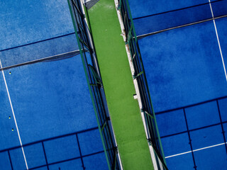drone aerial view of several balls on a paddle tennis court
