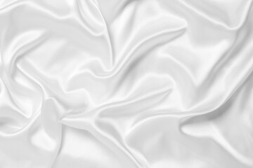 Smooth white silk or satin luxury cloth texture can use as wedding background. Luxurious background design.