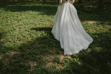Fototapeta premium wedding dress on the grass