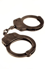 pair of police handcuffs, isolated