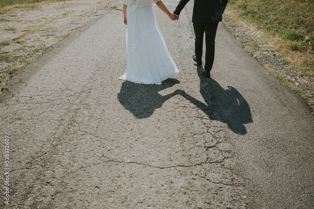 Wall mural bride and groom walking