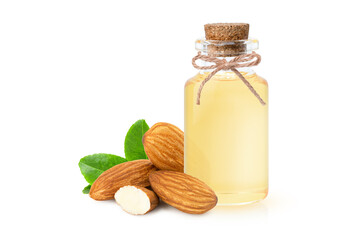 Almond oil in glass bottle and almond nuts with green leaf isolated on white background.
