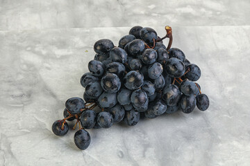 Purple grape branch over background