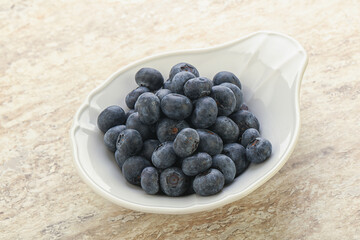 Sweet ripe blueberry heap in the bowl