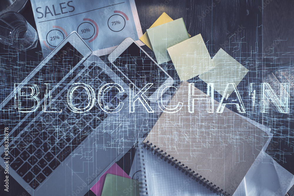 Poster Blockchain theme hologram drawings over computer on the desktop background. Top view. Double exposure.