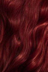 Fototapeta premium Dark red hair close-up as a background. Women's long brown hair. Beautifully styled wavy shiny curls. Coloring hair with bright shades. Hairdressing procedures, extension.