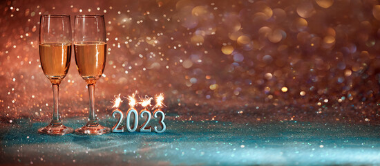 2023 New Year. 2023 happy new year greeting card. Champagne glasses on glitter background, new year