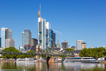 Fototapeta premium Frankfurt skyline with Main river and Eiserner Steg Bridge travel traveling in Germany
