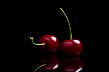 Red ripe fresh cherries in drops of water close up. Cherry background. Berry pattern and texture. Food background.