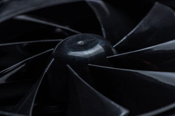 close up of computer fan on a black background