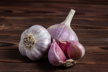 Garlic bulb on wooden background close up