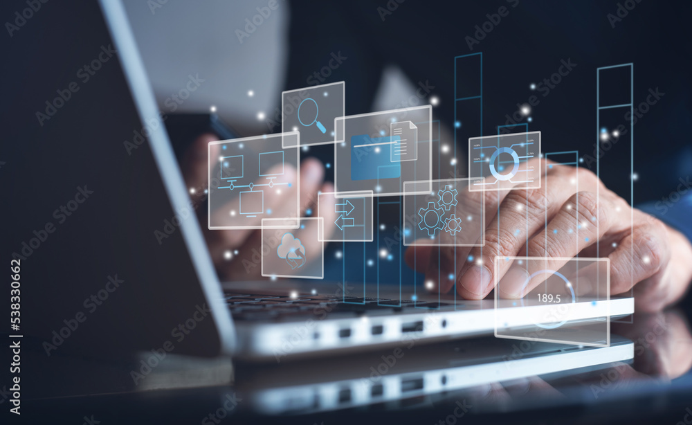 Poster data management system. analyst working with business analytics documents on computer to make report