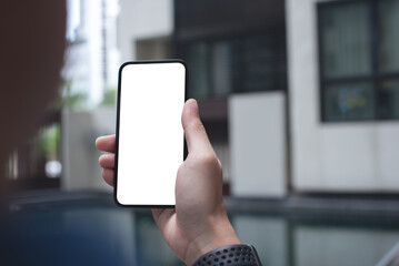 Mockup image of mobile phone for advertising. Mock up image of man hand holding and using smartphone with blank screen for mobile app design or text advertisement