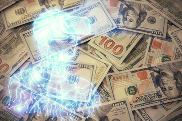 Double exposure of man wearing VR glasses drawing over usa dollars bill background. Concept of virtual reality.
