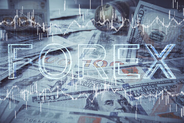 Obraz premium Multi exposure of forex chart drawing over us dollars bill background. Concept of financial success markets.