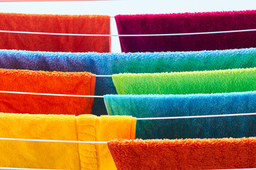 Colorful towels drying in the sun