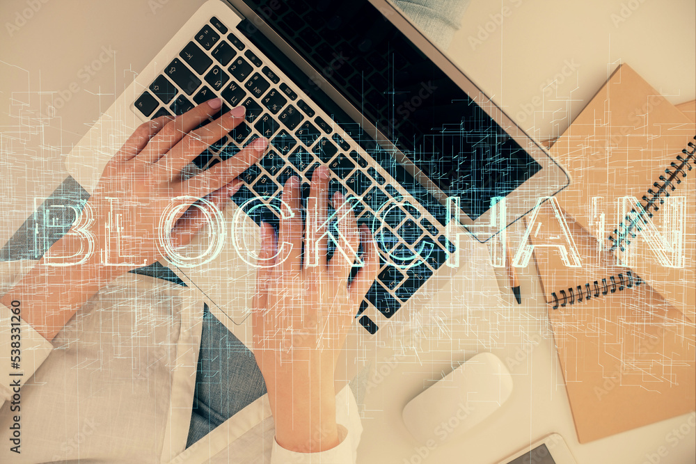 Poster double exposure of woman hands working on computer and blockchain theme hologram drawing. top view. 