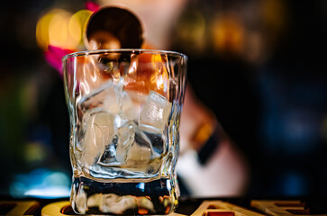 bartender pouring gin in bar